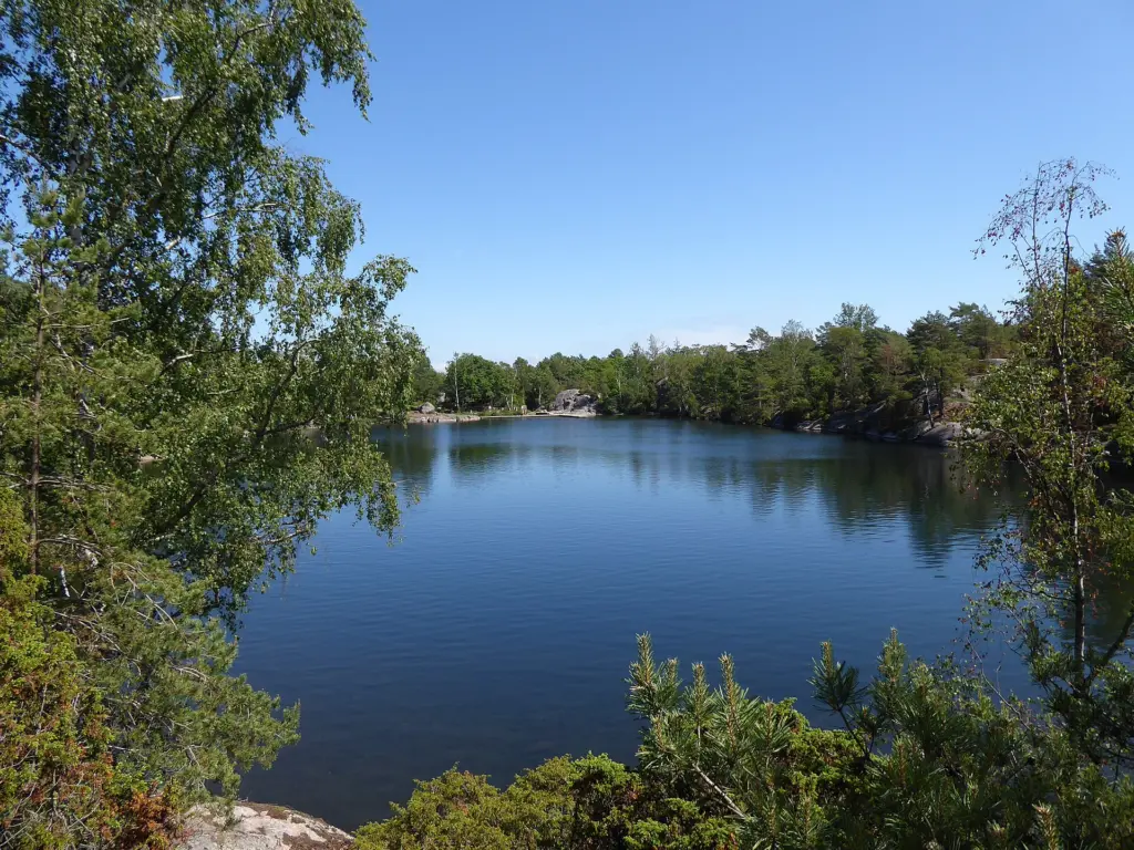 The small lake Färås tjärn, Sandsjöbacka nature reserve, Västergötland, Sweden from W direction E on July 8, 2023.