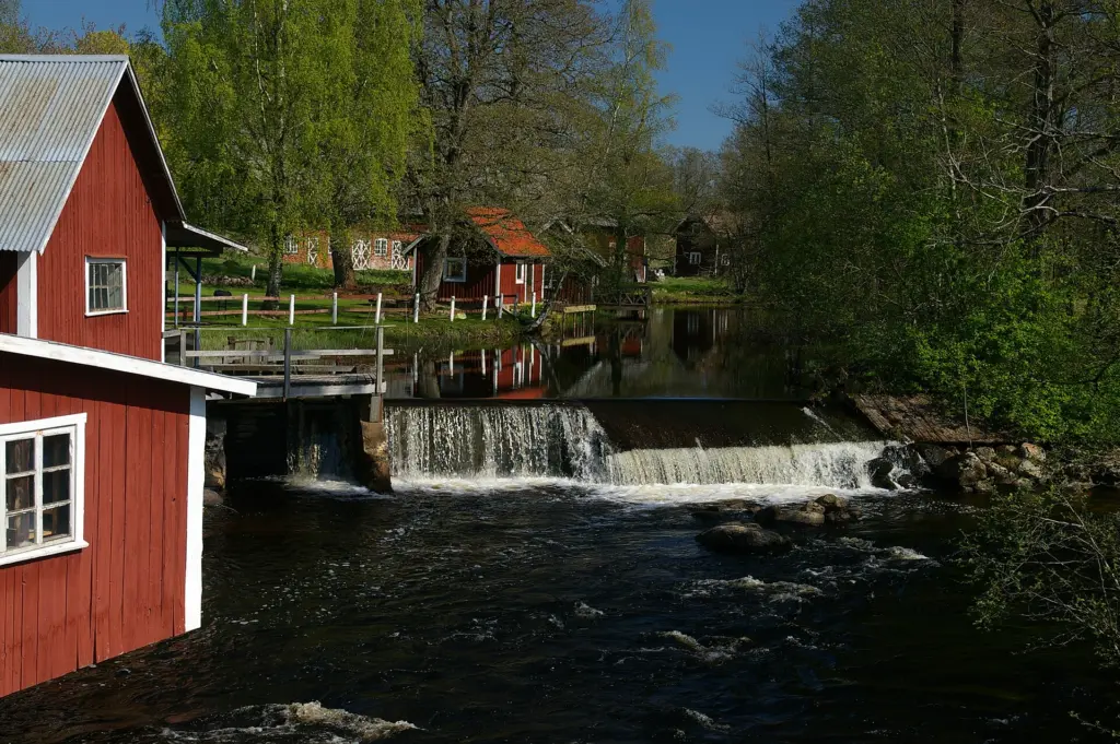 The village Madängsholm i Västergötland, Sweden and the river Tidan.