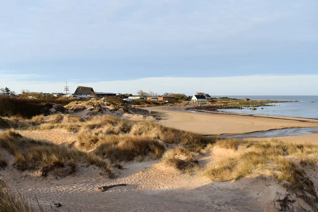 Vilshärad, the beach with the dunes and Strandgården in the background
